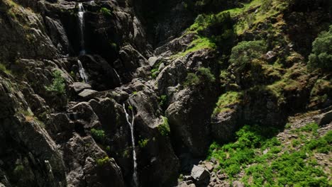 HE-SPECTACULAR-MEANCERA-WATERFALL-IN-THE-NORTH-OF-EXTREMADURA-LANDSCAPED-IN-A-NATURAL-PLACE-A-WATERFALL-100-METERS-RECORDED-WITH-MAVIC-3-IN-C4K-30FPS-AND-WITHOUT-COLOR-CORRECTION