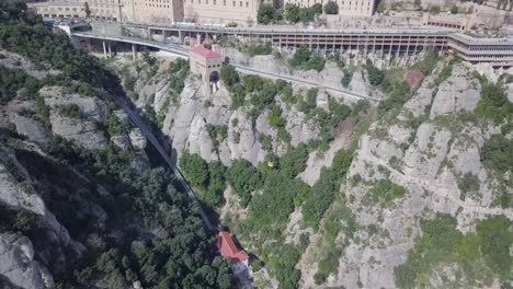 Aerial-Shot-Of-Abbey-of-Montserrat-With-Tourism-Gondola