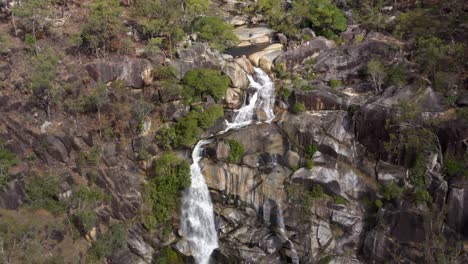 Davies-Creek-Falls-waterfall-backward-aerial-near-Mareeba,-Queensland,-Australia