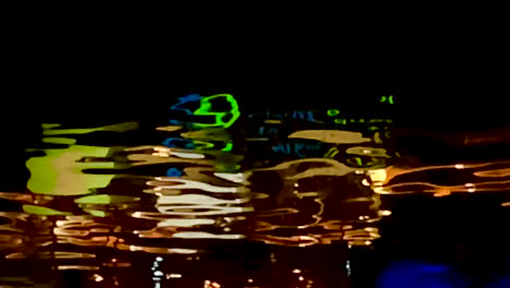 Reflection-of-the-Clarke-Quay-sign-in-the-Singapore-river-at-night