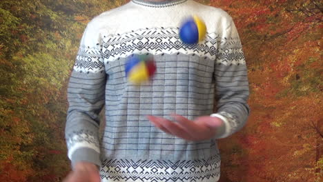 Mann-Jongliert-Mit-Drei-Mehrfarbigen-Bällen-Mit-Blauen,-Grünen,-Gelben-Und-Roten-Farben
