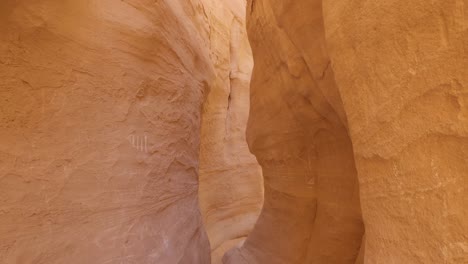 Looking-Down-Empty-Narrow-Sandstone-Slot-Canyon-In-Egypt