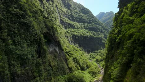 Aerial-view-of-a-tropical-ravine-at-noon-in-the-Reunion-Island