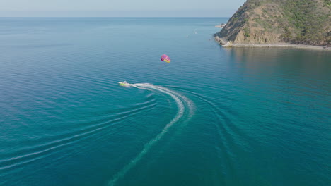 Flying-With-Parasailing-Adventurer-on-Crystal-Blue-Pacific-Ocean-off-Catalina-Island