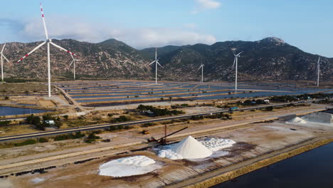 Aerial-view-of-salt-fields-spread-across-windmill-farm-in-Phan-Rang