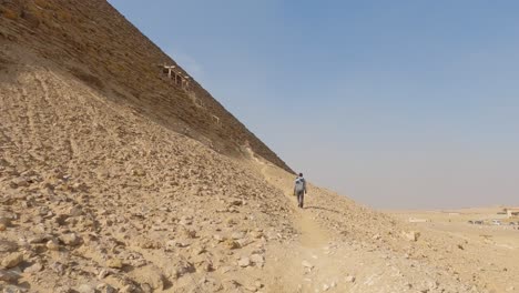 Tourist-Hiking-Around-The-Ancient-Egyptian-Dahshur-Red-Pyramid-In-Egypt