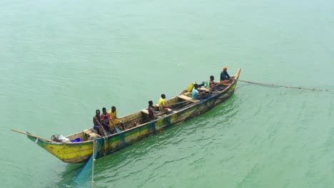 Aerial-shot-of-a-boat-or-canoe-fishing-in-a-sea-during-the-day_4