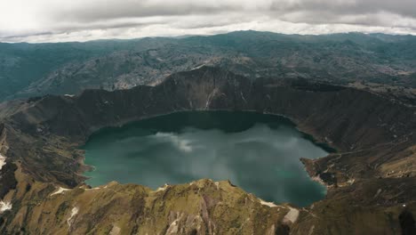 Panoramic-view-of-wonderful-crater-lake-landscape-surrounded-by-volcanoes-in-Ecuador