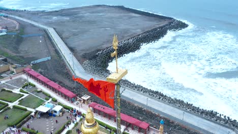 Aerial-shot-of-saffron-flag-blowing-in-the-wind-which-is-in-the-top-of-the-Somnath-mandir