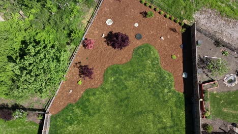 Top-down-aerial-shot-of-a-yard-with-beautiful-bark-and-landscaping