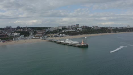 Low-wide-drone-shot-towards-Bournemouth-Pier