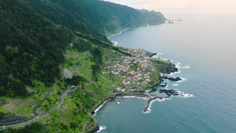 High-elevation-aerial-view-over-scenic-Seixal-village-on-Madeira-coastline