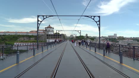 Walking-in-the-Middle-of-Dom-Luís-I-Bridge-on-Tram-Tracks