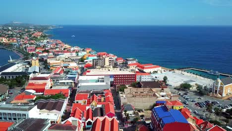 Aerial-view-dolly-in-of-Punda-district-in-the-city-of-Willemstad,-Curacao,-Dutch-Caribbean-island