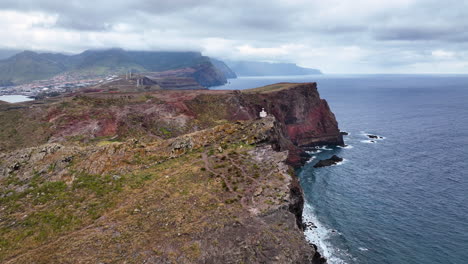 Aerial-over-steep-sheer-sea-cliffs-and-beacon-at-easternmost-point-of-Madeira