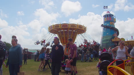 Royal-Cornwall-Show-2022-Fairground-with-People-and-Carousel-Rides-of-Children-Enjoying-a-Summers-Day-in-Cornwall