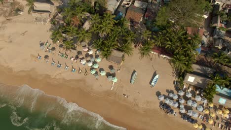 Umbrellas-And-Cottages-At-The-Tropical-Beach-Resort-In-Yelapa,-Jalisco,-Mexico