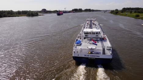 Aerial-Over-Stern-Of-LNG-Tanker-Blue-Christina-Travelling-Along-Oude-Maas