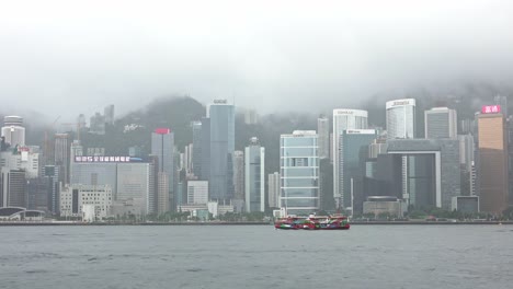 Star-Ferry-Sailing-in-Victoria-Harbour-in-Foggy-Morning,-Hong-Kong