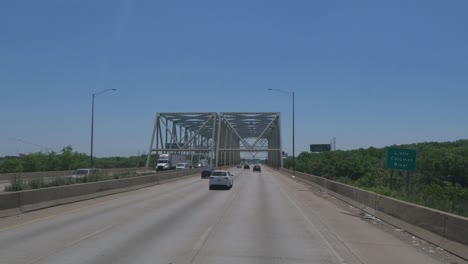 Traveling-in-Illinois-State-Tollway-roads-and-streets-construction-slow-traffic-at-rush-hour-near-Chicago-under-bridge