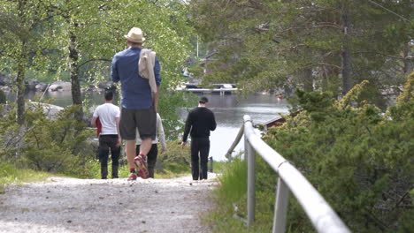 men-walking-on-a-nature-path-headed-towards-the-bay