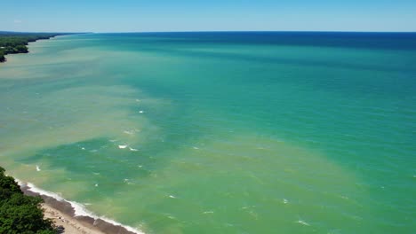 Spectacular-Aerial-drone-video-footage-of-beautiful-Lake-Erie-during-summer-on-a-sunny-day