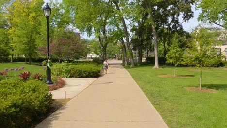 Walking-on-a-Sidewalk-in-Late-Spring,-Early-Summer