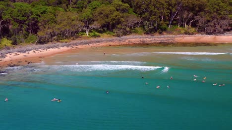 Scenic-View-Of-Tourist-Surfing-At-Noosa-National-Park-Near-Noosa-Heads-In-Queensland,-Australia