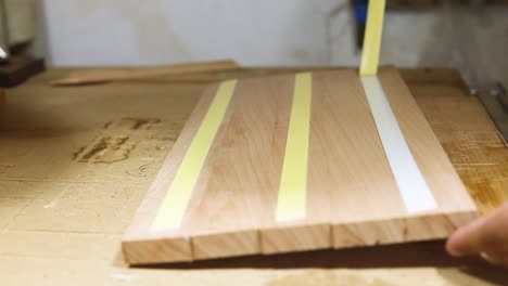 Preparing-wooden-board-for-cutting-on-the-cnc-machine