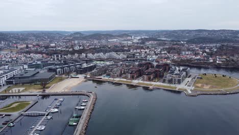 Aerial-view-of-Kristiansand-Norway-with-beach-and-river-Otra---Idyllic-Norwegian-city-with-modern-architecture-and-Christianholm-marina