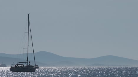 Sailboat-traveling-through-the-shimmering-sea