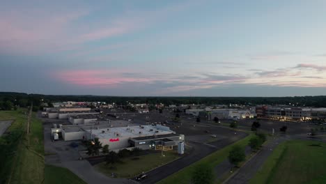 Strip-Mall-At-Twilight-With-Empty-Parking-Lot-Aerial-View