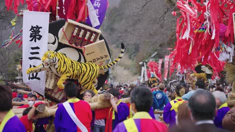 Year-of-the-Tiger-celebration,-teams-carry-Sagicho-Matsuri-Floats-in-Crowd