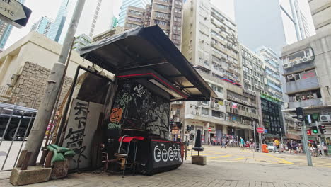 Timelapse-of-closed-newspaper-stand-with-graffiti-in-Kwun-Tong-Industrial-Area,-Hong-Kong