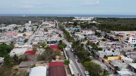 Aerial-shot-of-houses-and-street-with-trees-in-the-Akumal,-Tulum,-Quintana-Roo,-Mexico