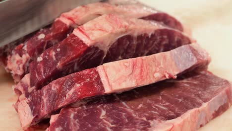 Chef-cutting-Angus-beef-meat-for-steaks