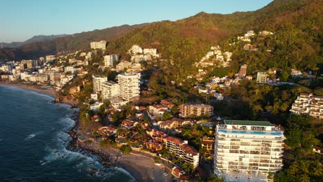 Rocky-mountainous-coastline-beach-in-Playa-Amapas-in-Puerto-Vallarta-Mexico,-aerial