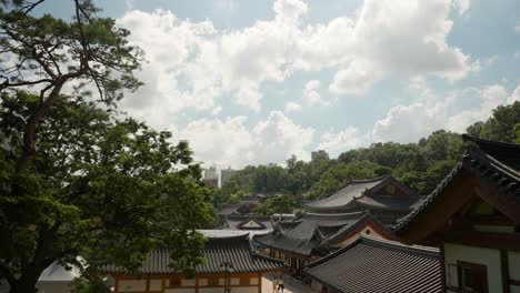 High-angle-view-of-Bongeunsa-Buddhist-Temple-against-white-clouds-in-Seoul,-South-Korea