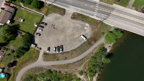Top-down-aerial-of-parking-at-a-trail-head-along-the-Spokane-River
