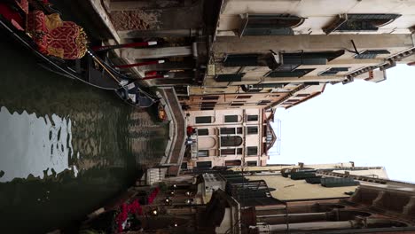 Vertical---Narrow-River-Canal-in-Famous-Touristic-City-of-Venice,-Italy
