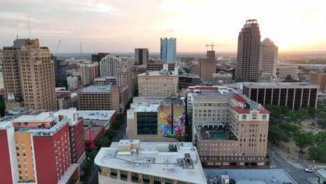 Aerial-truck-shot-of-San-Antonio-Alamo-Plaza-and-hotels,-buildings,-office-highrise-towers