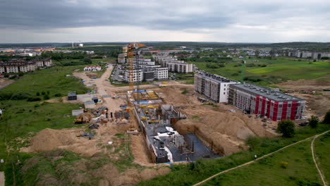 Aerial-trucking-shot-of-large-construction-site-built-new-modern-houses-and-blocks-in-Poland