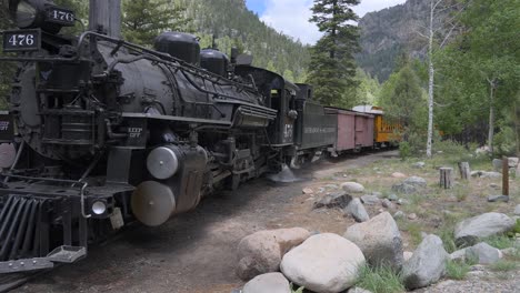 Locomotive-performing-a-blowdown-at-a-rest-stop-in-the-forest