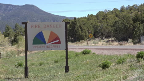 First-responder-firefighter-truck-drives-past-extreme-fire-danger-sign