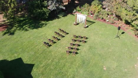 Outside-drone-shot-of-homemade-wedding-ceremony