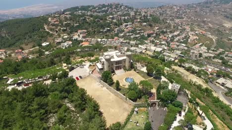 Orbit-Shot-Of-Remarkable-Palace-On-Top-Of-Old-Village-Aerial-Landscape-,-Baissour,-Lebanon
