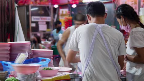 Michelin-star-street-food-vendor-cooking-Kway-Chap-food-on-Yaoearaj-road-Chinatown