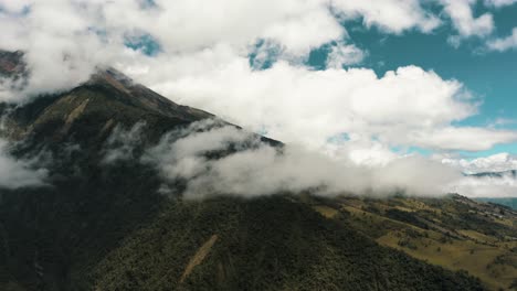 Rainforest-On-Lush-Valley-With-Tungurahua-Volcano-Covered-With-Cloudscape-In-Ecuador