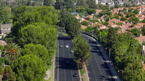 Aerial-telephoto-view-of-traffic-on-a-freshly-paved-road-in-Orange-County,-California