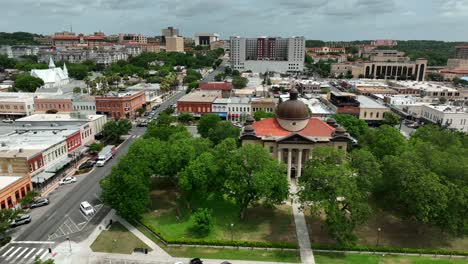 Wide-aerial-of-downtown-San-Marcos-Texas-with-Hays-County-Courthouse-and-TX-State-University-in-distance